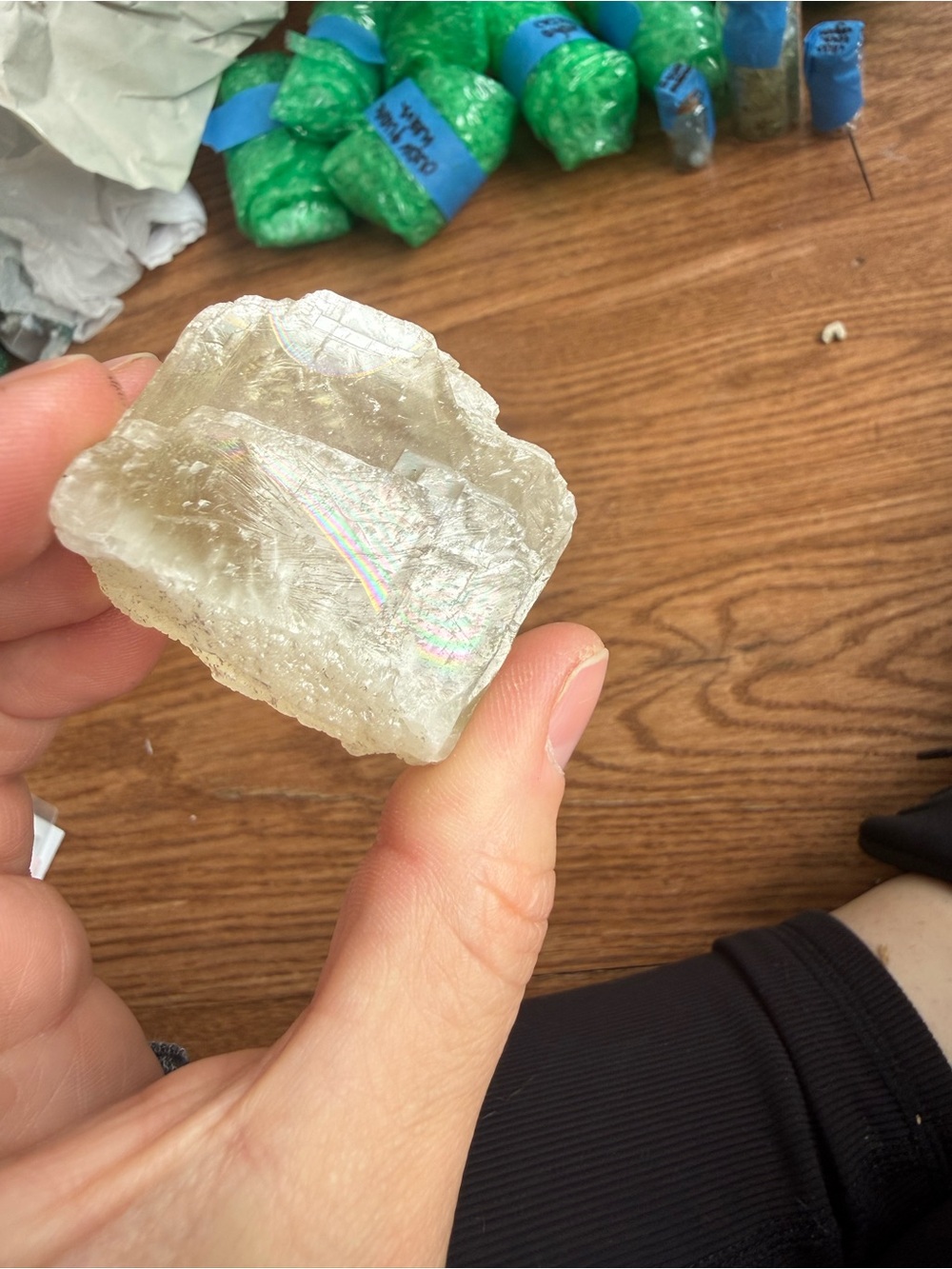 Soft yellow optical calcite piece with huge rainbow